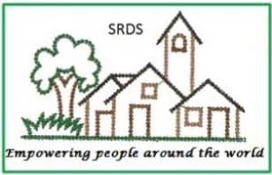 Logo for SRDS, an embroidered design of houses and a tree with text 'Empowering people around the world'.